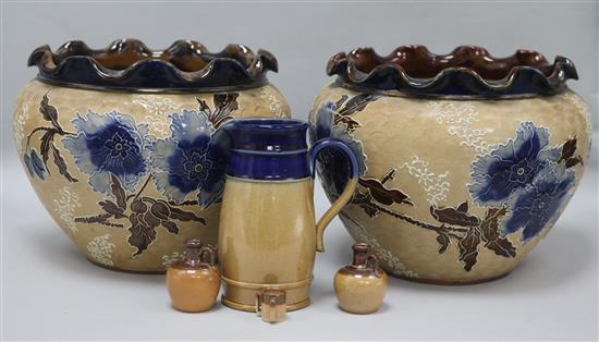A pair of Doulton Lambeth stoneware jardinieres, three jugs and a tyg